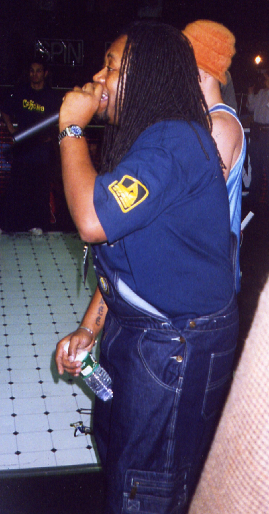 MC performing live at a SPIN event wearing Madsoul denim overalls