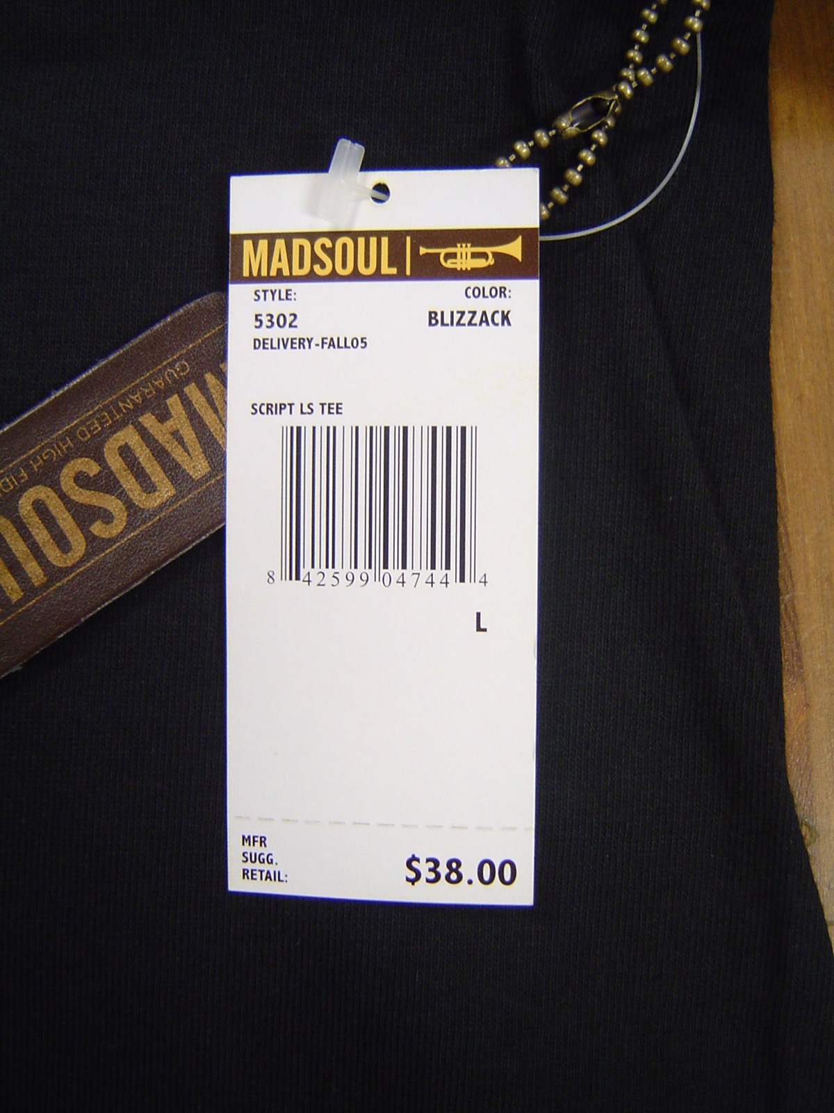 Real Madsoul hangtag with trumpet mark, style number, and 38 dollar price